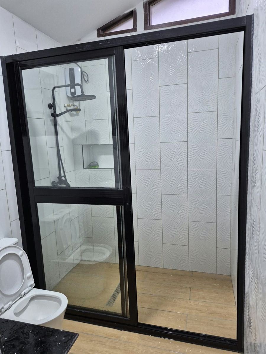 New bathroom with framed glass shower screen