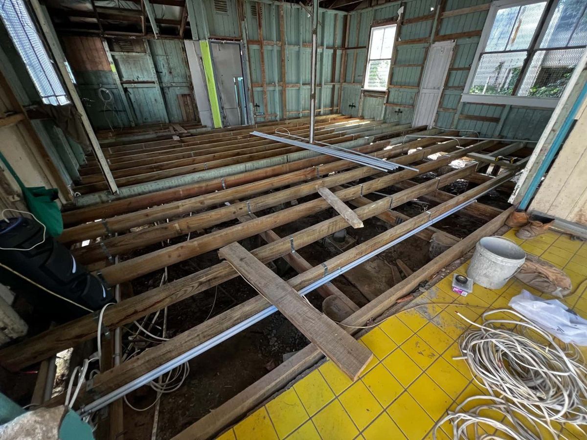 New floor joists, with conduit run beneath