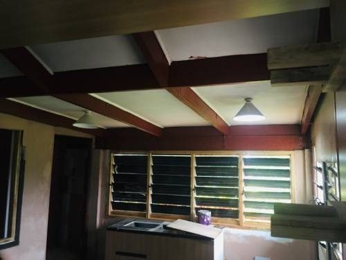 Kitchen — new windows and restained rafters, in progress