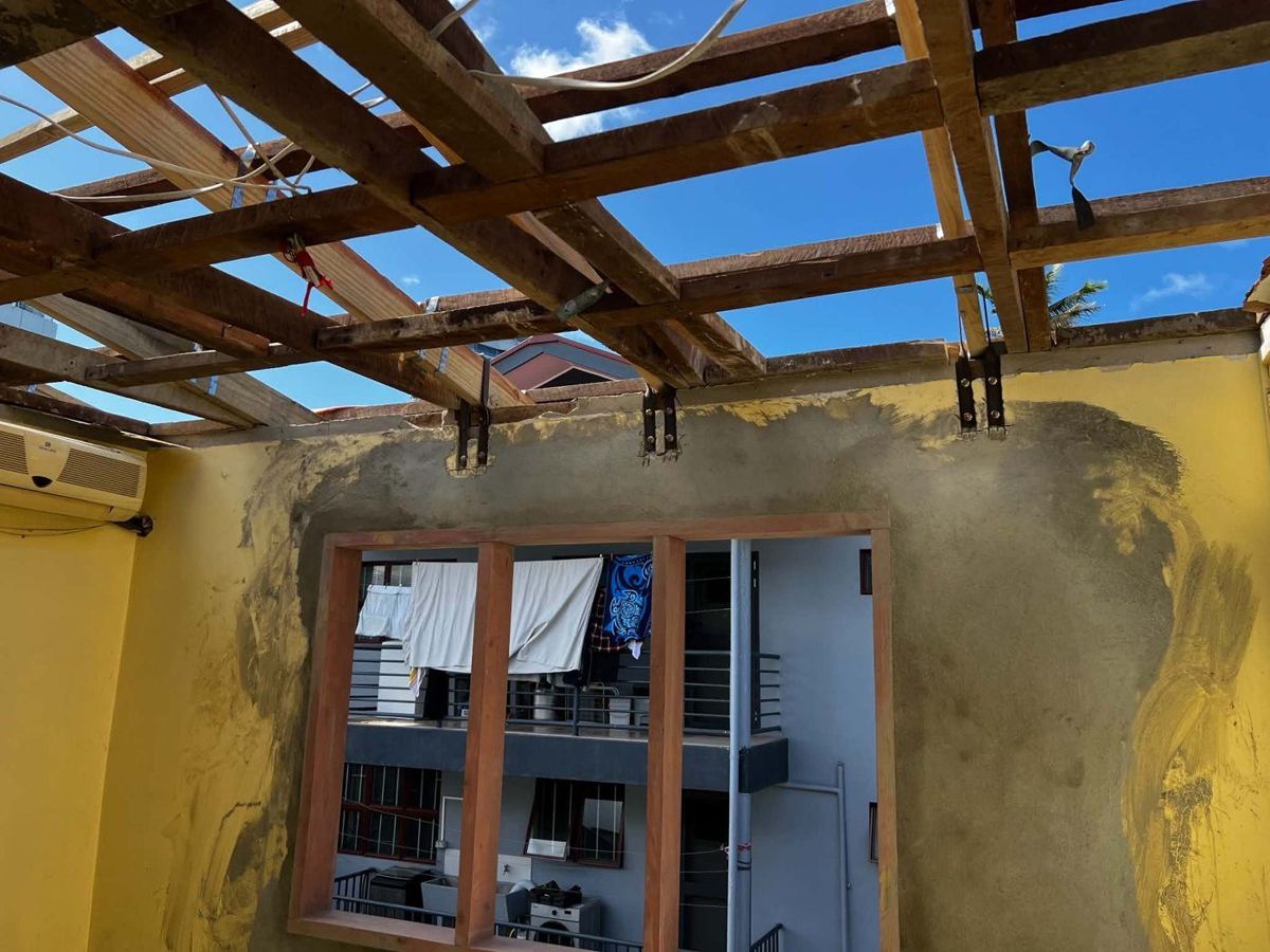Roof framing tied down to the block wall with steel brackets