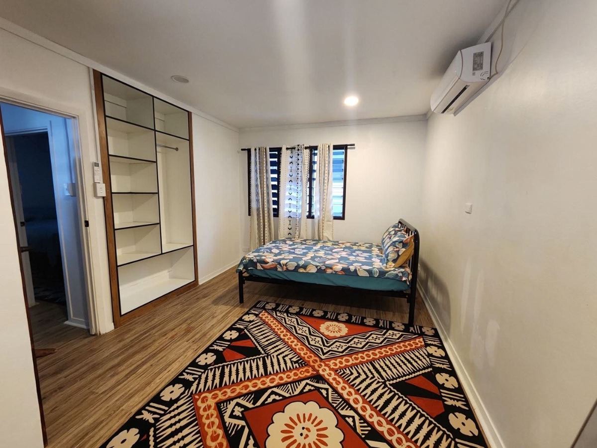 Bedroom with built-in shelving
