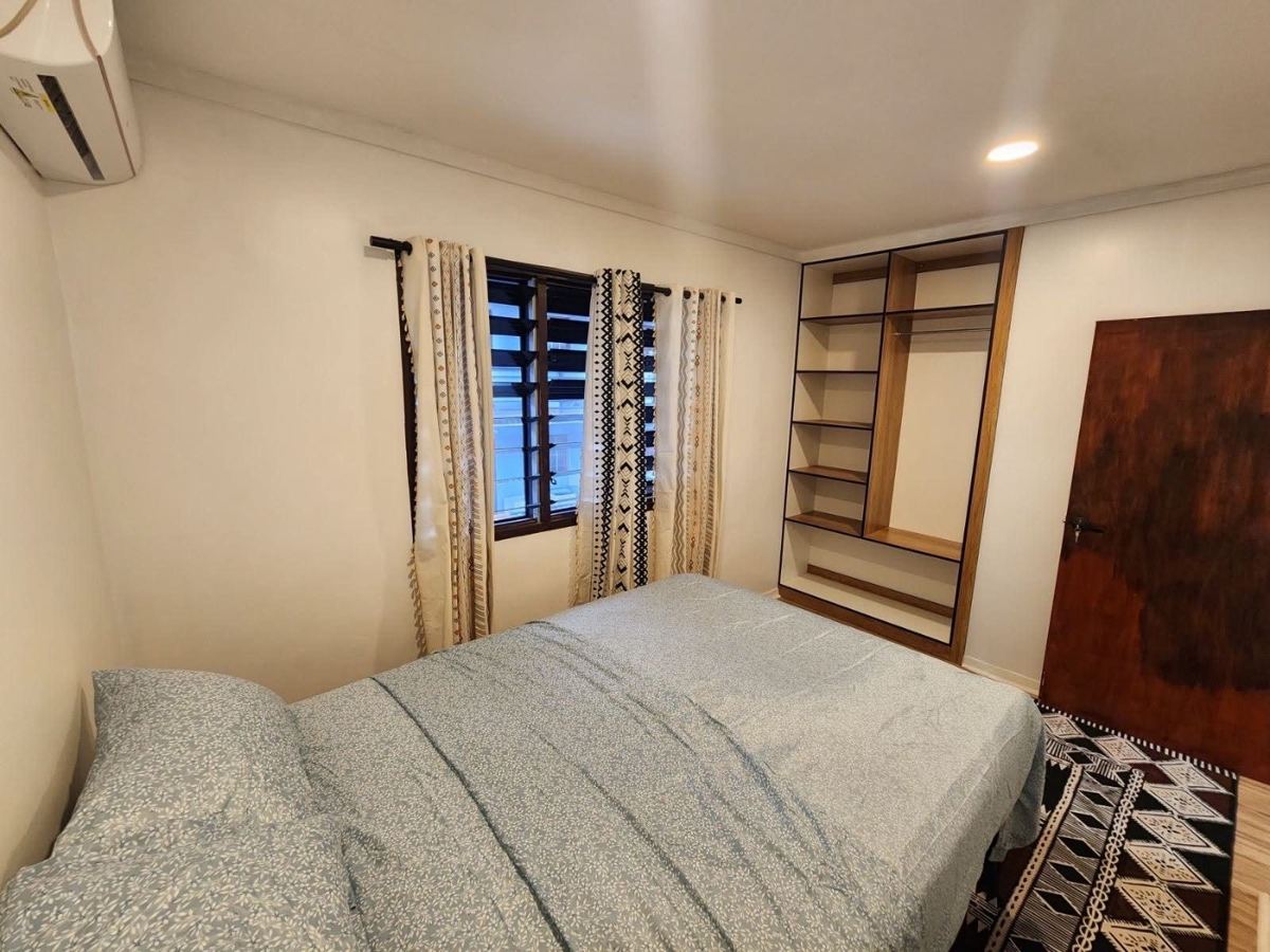 Second bedroom with built-in shelving