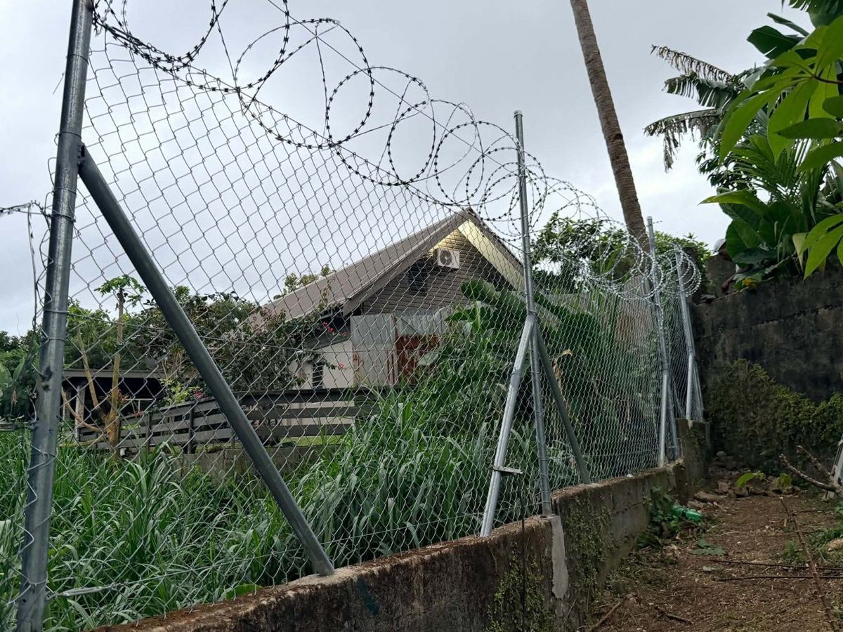 Completed chainlink and razor-wire fence, September 2026