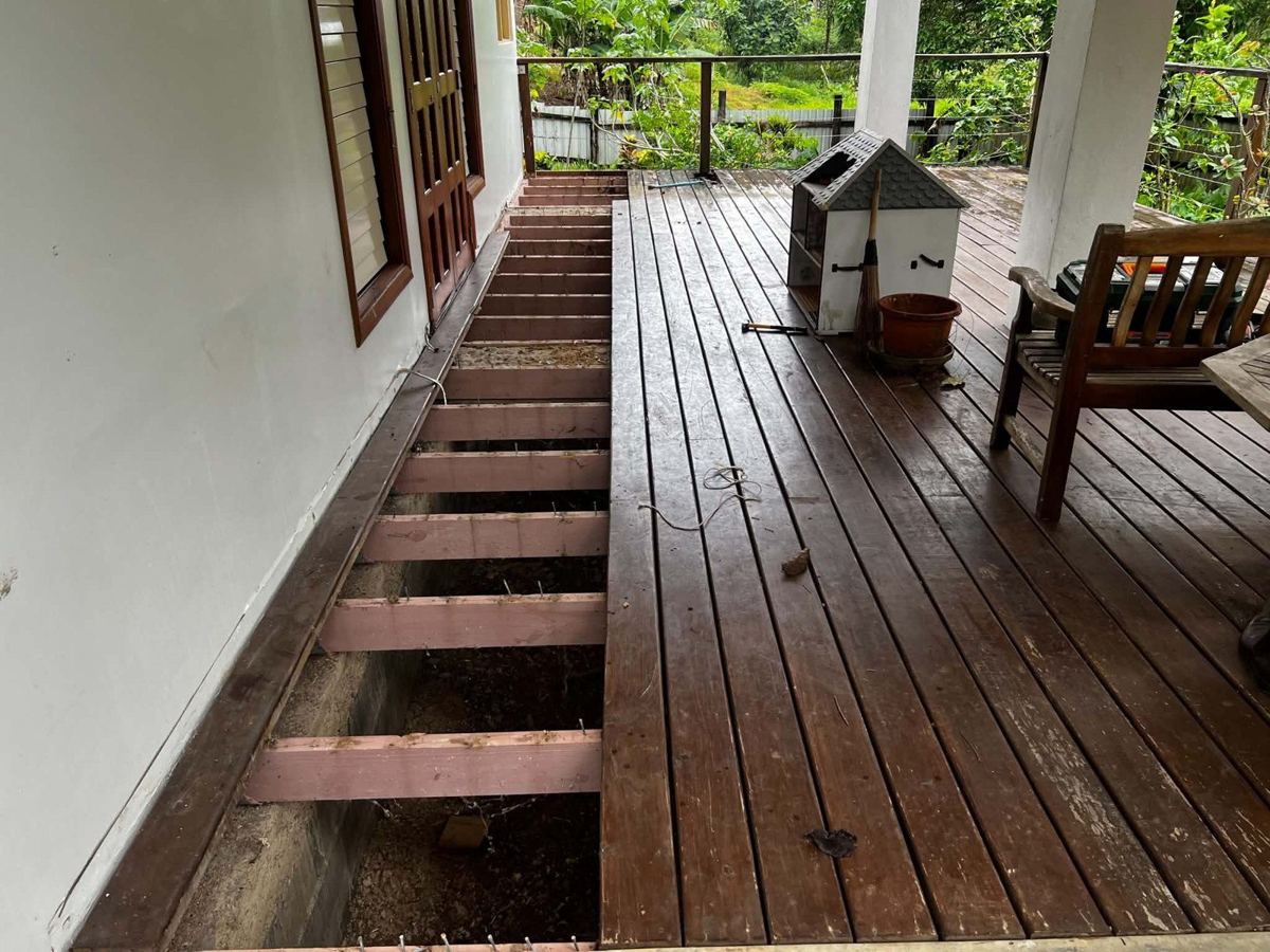 The old deck, part-stripped — before