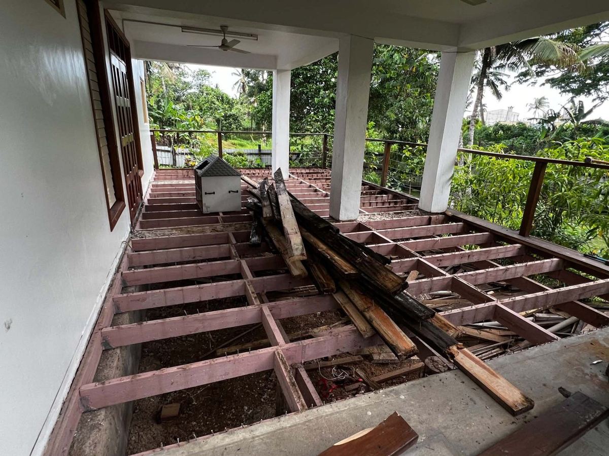 Old boards lifted, exposing the frame