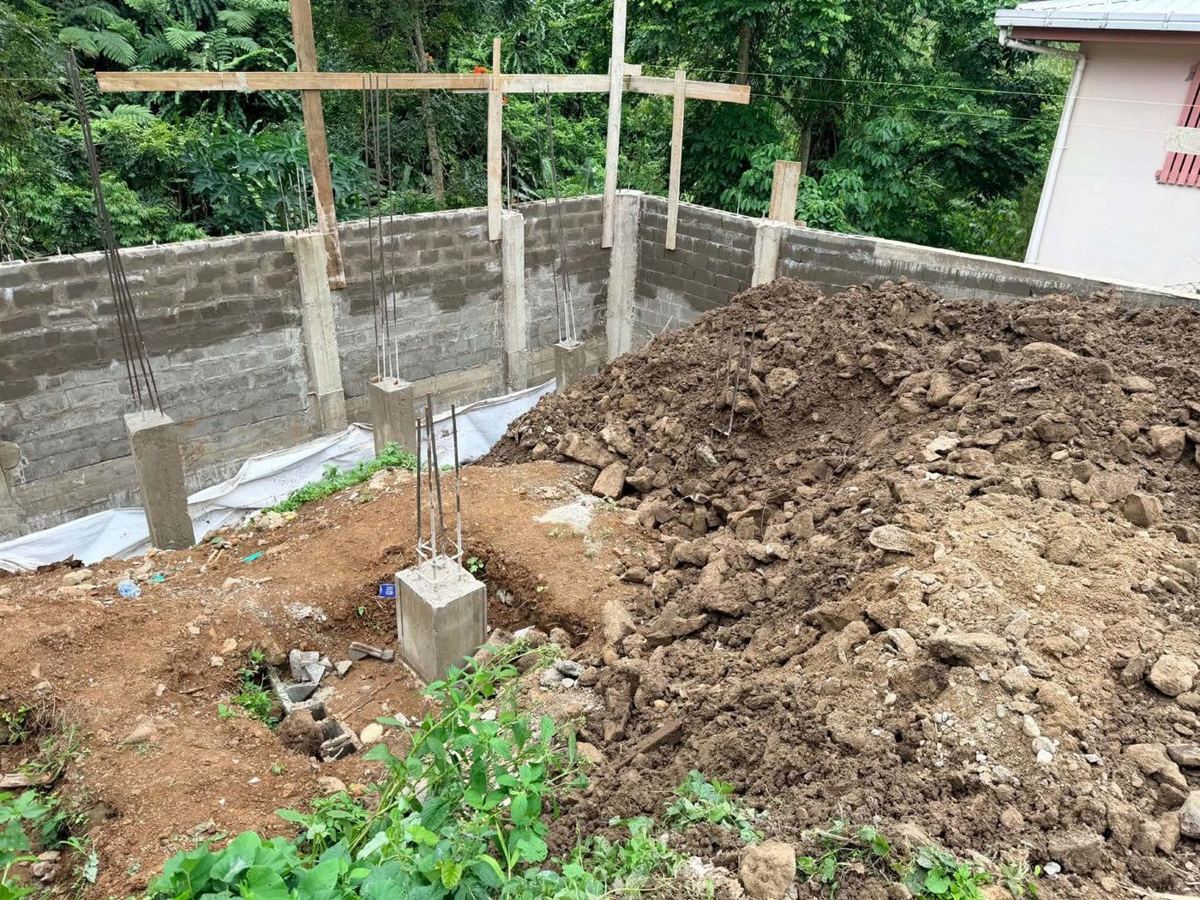 Second wall complete and backfilled to form the building platform