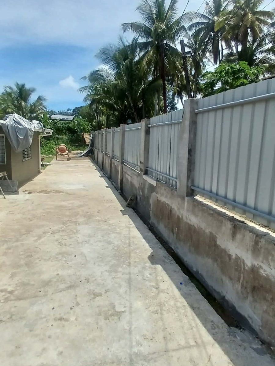 Completed: rebuilt wall fence with sheet panels