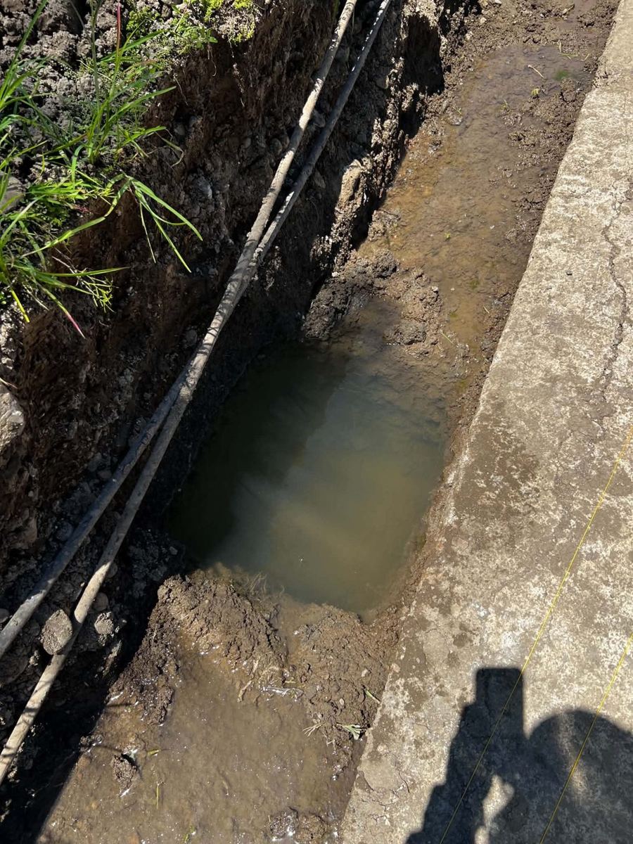 Groundwater filling the excavated trench